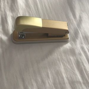 A gold stapler